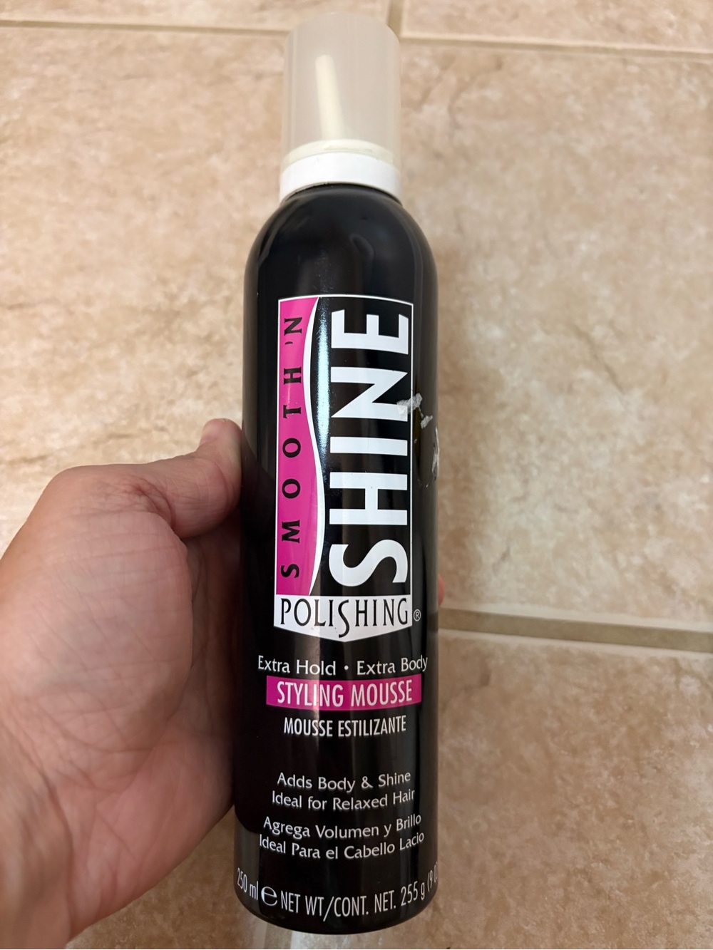 black bottle of Smooth 'N Shine Polishing Extra Hold Extra Body Styling Mousse